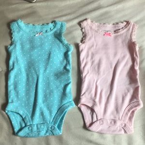 Two blue and pink tank onsies size newborn never worn